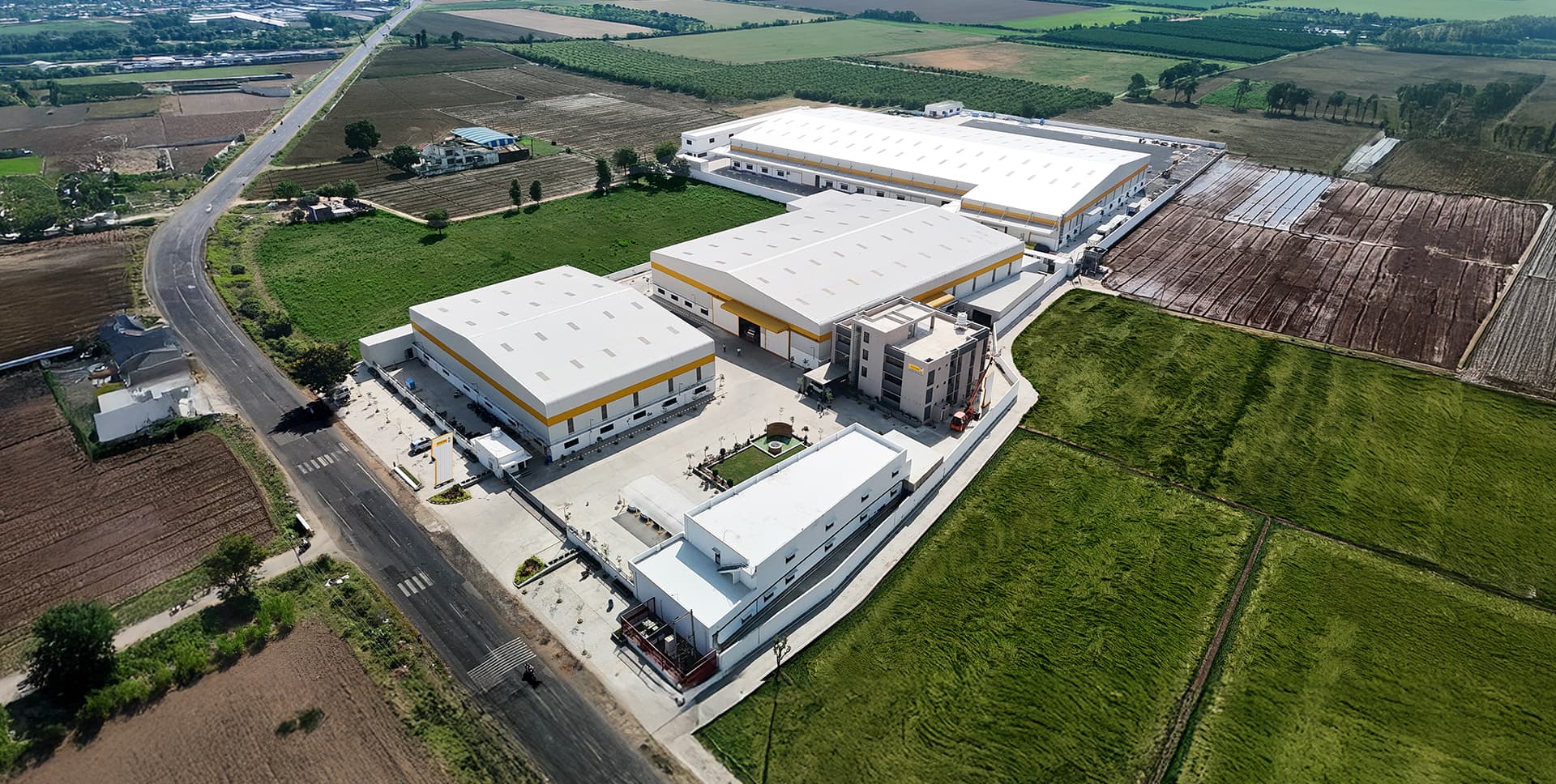 Aerial view of the A V Cam Corporation manufacturing facility in Prantij, Gujarat